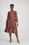 Velvet flocked flowerchiffon tealength dress with standup collar, pleated sleeves and wide fitted cuffs closed with buttons  Style: Kristin Cb: 113 cm (Skirtlength 75 cm) Mat: 32% Pa, 65% Pol,3% Elastane Lining: 100% Acetate