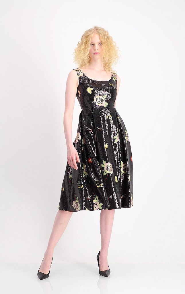 Thang de Hoo - Black minisequence sleeveless tealength dress embroided with multicolor flowers with rounded neckline,pleaded skirt with pockets  Style: Nora